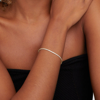 Guld tennisarmband
