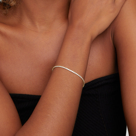 Guld tennisarmband