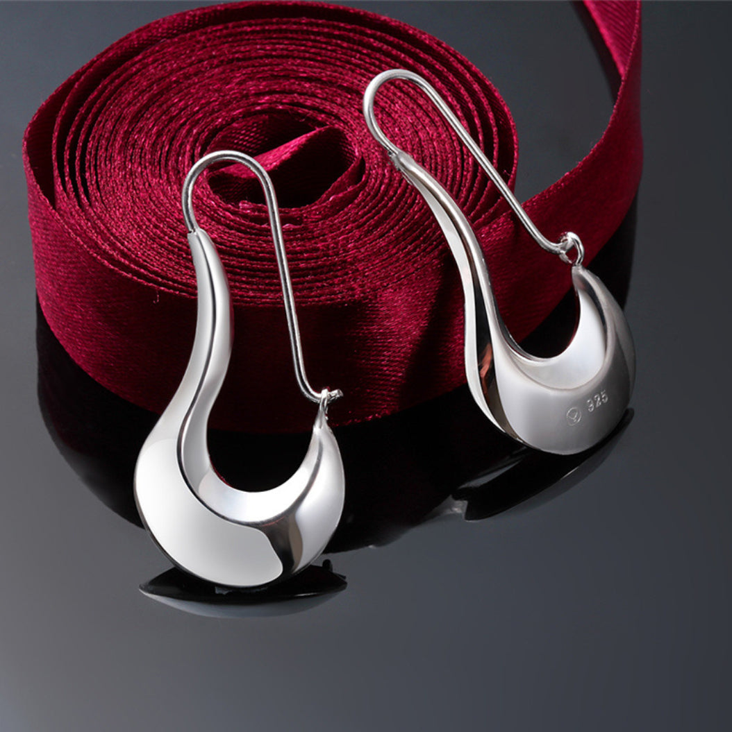 Modernistiska silverörhängen för kvinnor