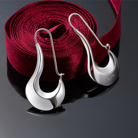 Modernistiska silverörhängen för kvinnor